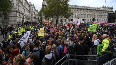 Activists protest on Whitehall, by Downing Street during the second day of climate change demonstrations by the Extinction Rebellion group in central London, on October 8, 2019. (AFP)