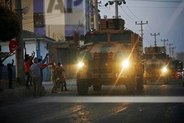 Turkish forces vehicles being driven through the town of Akcakale, Sanliurfa province, southeastern Turkey, at the border between Turkey and Syria, on October 9, 2019. (AP)