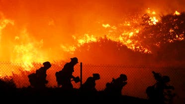 Firefighters battle the Saddleridge fire in Sylmar, Calif., Friday Oct. 11, 2019. (AP Photo)