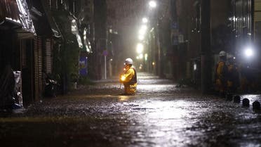 Firefighters patrol on a flooded road due to heavy rains caused by Typhoon Hagibis at Ota ward in Tokyo, Japan, October 12, 2019. (Reuters)