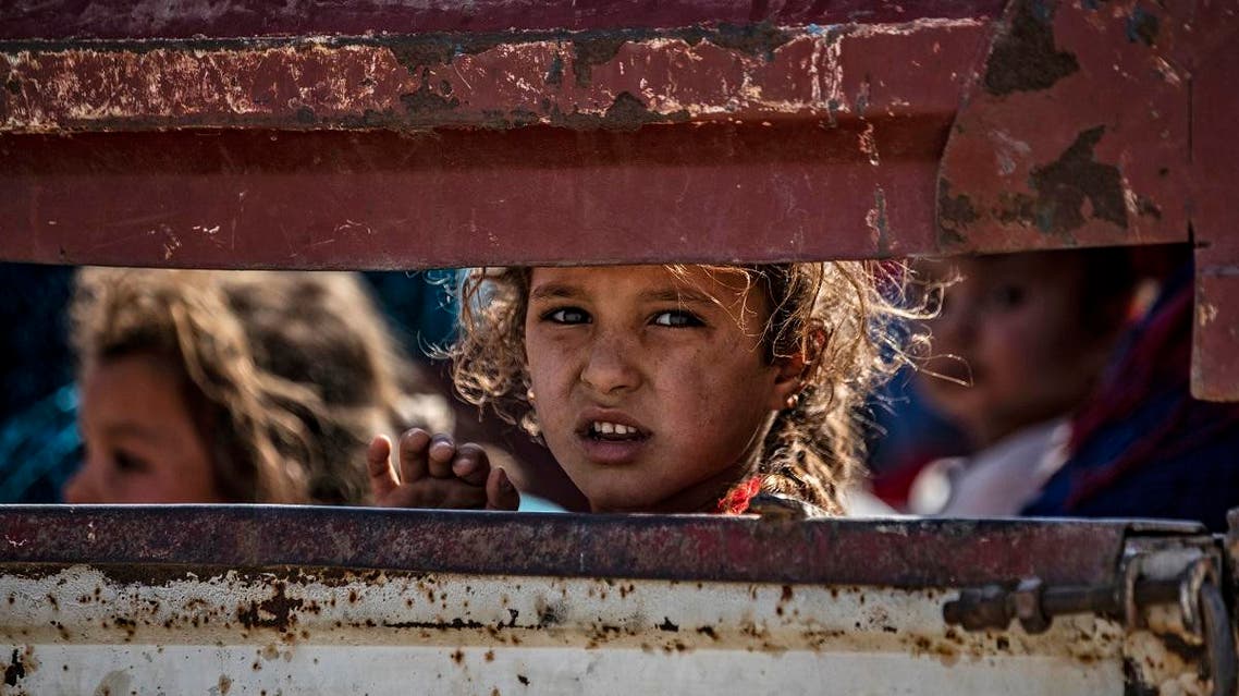 Syrian Arab and Kurdish civilians arrive to Tall Tamr town, in the Syrian northwestern Hasakeh province, after fleeing Turkish bombardment on the northeastern towns along the Turkish border on October 10, 2019. (AFP