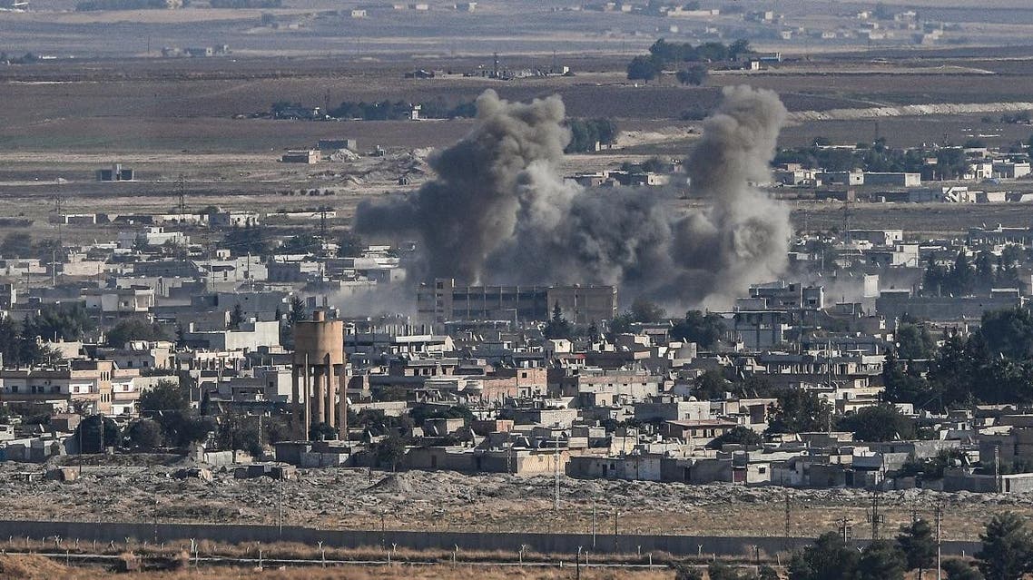 This picture taken on October 13, 2019 from the Turkish city of Ceylanpinar shows smoke rising from the Syrian border town of Ras al-Ain as fighting rages along the border on the fifth day of a Turkish offensive in Syria against the Kurdish People's Protection Units (YPG) that has provoked an international outcry and left dozens of civilians and fighters dead. (AFP)