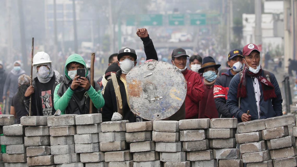 Anti-government demonstrators man a barricade during clashes with the police, near the national assembly building in Quito, Ecuador, Saturday, Oct. 12, 2019. (AP)