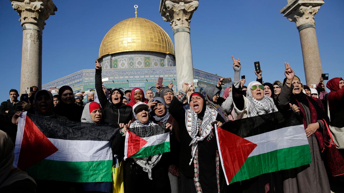 Palestinians protest against U.S. President Donald Trump's decision to recognize Jerusalem as the capital of Israel at the al-Aqsa mosque compound in Jerusalem Friday, (AP)
