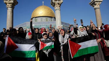 Palestinians protest against U.S. President Donald Trump's decision to recognize Jerusalem as the capital of Israel at the al-Aqsa mosque compound in Jerusalem Friday, (AP)