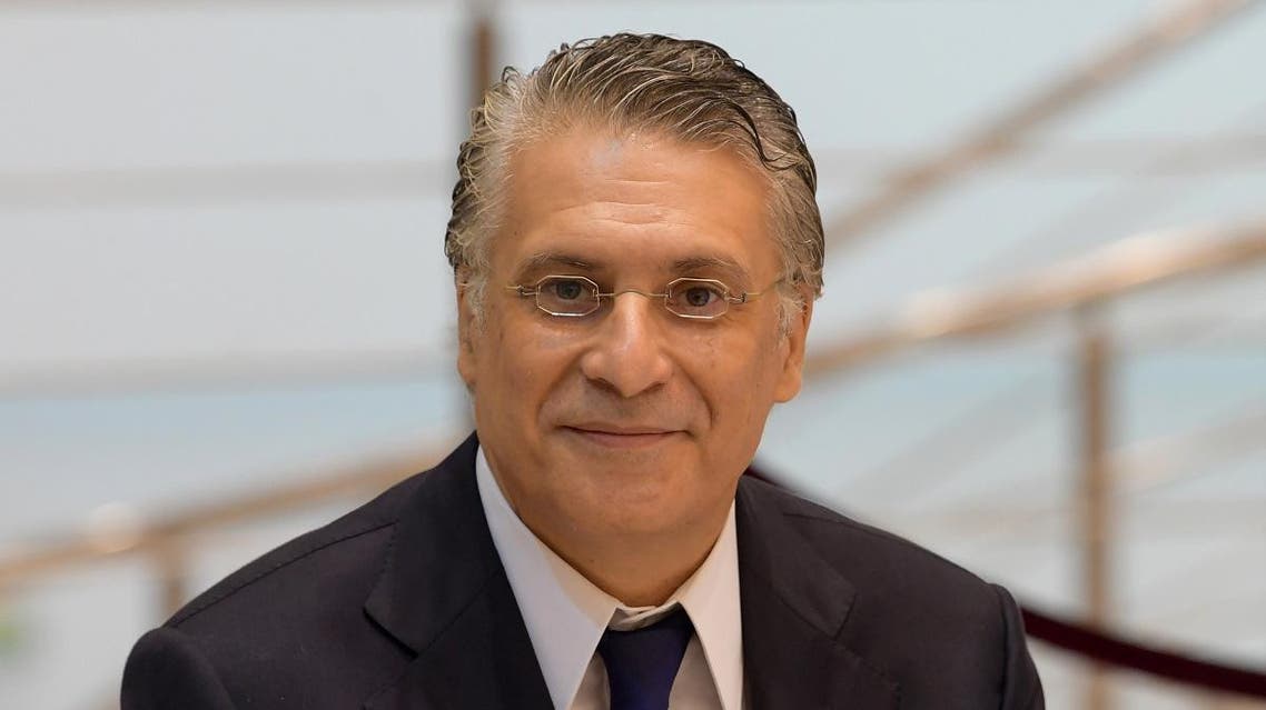 Tunisia's presidential candidate and business tycoon Nabil Karoui, 56, arrives for a debate before the second round of the presidential elections on October 11, 2019 in Tunis. (AFP)