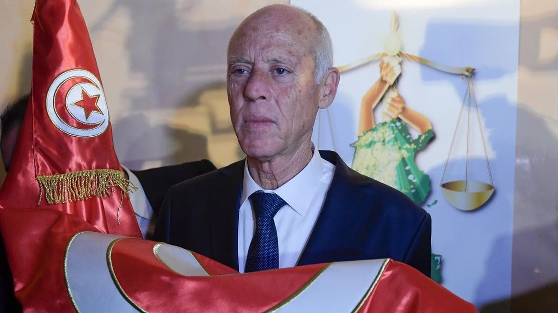 Conservative academic Kais Saied celebrates his victory in the Tunisian presidential election in the capital Tunis on October 13, 2019. (AFP)