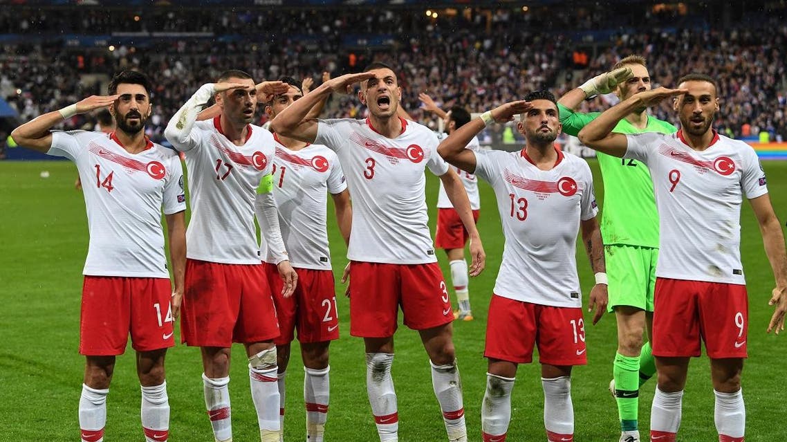 Turkish players salute at the end of the Euro 2020 Group H qualification football match between France and Turkey at the Stade de France in Saint-Denis, outside Paris on October 14, 2019. (AFP)