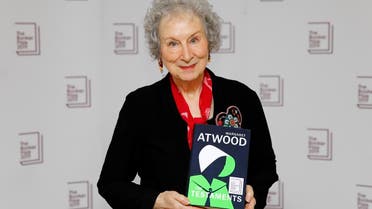 Canadian author Margaret Atwood poses with her book 'The Testaments' during the photo call for the authors shortlisted for the 2019 Booker Prize for Fiction at Southbank Centre in London on October 13, 2019. (AFP)