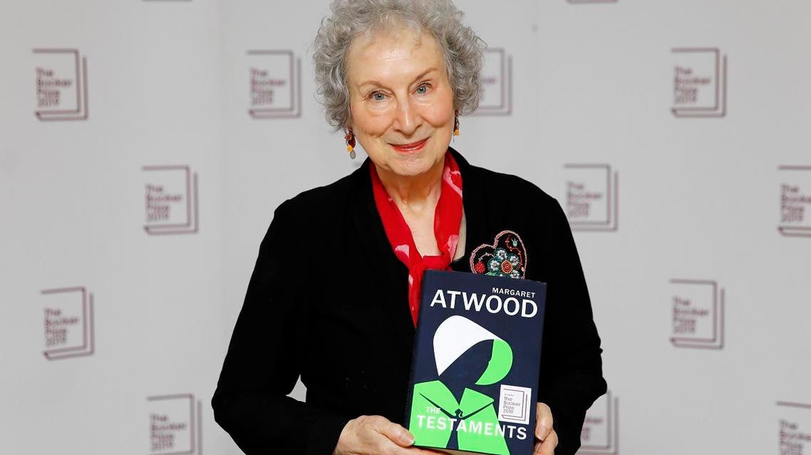 Canadian author Margaret Atwood poses with her book 'The Testaments' during the photo call for the authors shortlisted for the 2019 Booker Prize for Fiction at Southbank Centre in London on October 13, 2019. (AFP)