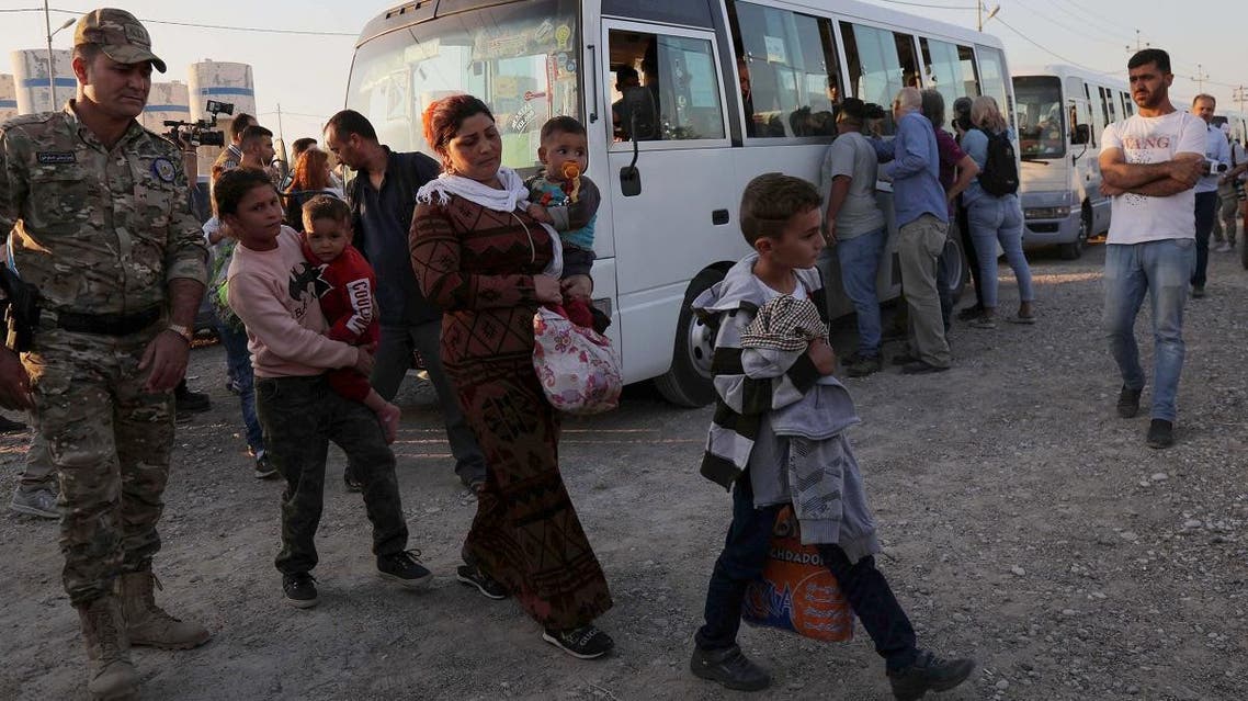 Syrians Kurds are pictured upon arriving at the Bardarash camp, near the Kurdish city of Dohuk, in Iraq’s autonomous Kurdish region, on October 16, 2019. (AFP)
