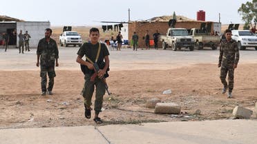 Syrian government forces gather at Tabqa air base in the northern Raqqa. (AFP)