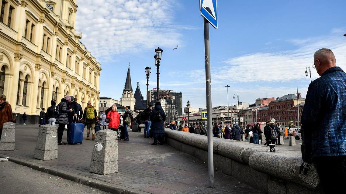 People walk past the building of Yaroslavsky railway station in Moscow on October 16, 2019. Yaroslavsky railway station was built in 1870 by Russian architect Fyodor Shekhtel and currently has the highest passenger throughput among Moscow's nine stations.(AFP)