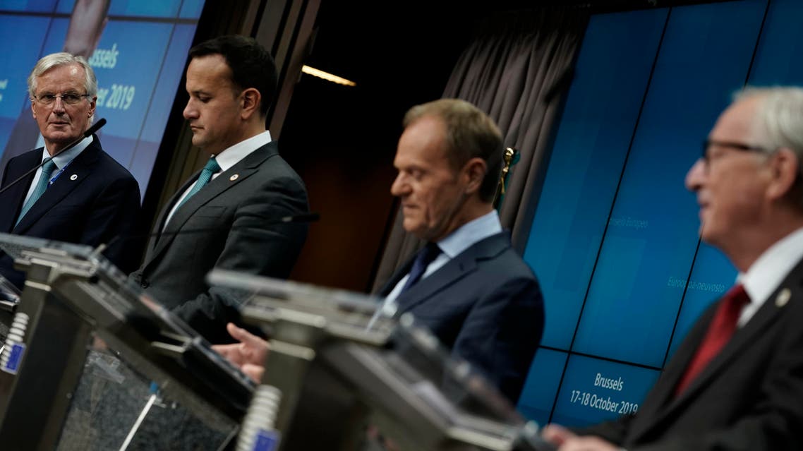 EU chief Brexit negotiator Michel Barnier, Ireland’s Prime Minister Leo Varadkar, European Council President Donald Tusk and European Commission President Jean-Claude Juncker address media representatives at a press conference during an European Union Summit at the EU Headquarters in Brussels on October 17, 2019. (AFP)