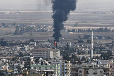 This picture taken on October 18, 2019 from the Turkish side of the border at Ceylanpinar district in Sanliurfa shows fire and smoke rising from the Syrian town of Ras al-Ain on the first week of Turkey's military operation against Kurdish forces. (AFP)