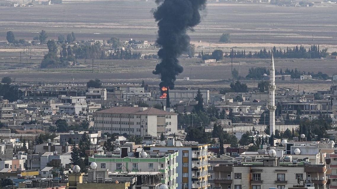This picture taken on October 18, 2019 from the Turkish side of the border at Ceylanpinar district in Sanliurfa shows fire and smoke rising from the Syrian town of Ras al-Ain on the first week of Turkey's military operation against Kurdish forces. (AFP)