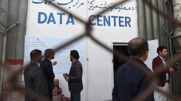 Observations and Independent Election Commission (IEC) officials look on in front of the Data Centre in Kabul on October 2, 2019. (AFP)