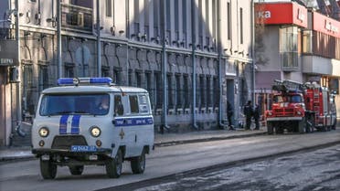 Russian police car and fire-engines are seen near a building housing the FSB security service in Arkhangelsk on October 31, 2018, after an explosive device went off inside the building. (AFP)
