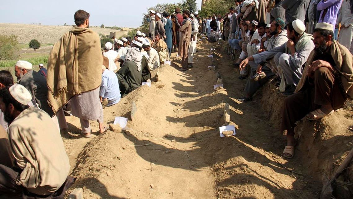 Afghan men bury victims of Friday's deadly bomb blast in the mosque in the village of Jodari at Haskamena district of Jalalabad east of Kabul, Afghanistan, Saturday, Oct. 19, 2019. (AP)