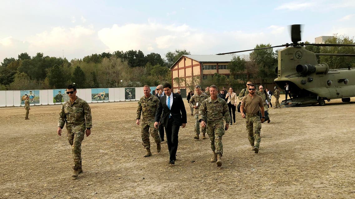 U.S. Defense Secretary Mark Esper, center, walks Gen. Scott Miller, right, chief of the U.S.-led coalition in Afghanistan, at the U.S. military headquarters in Kabul, Afghanistan, Sunday, Oct. 20, 2019. (AP)