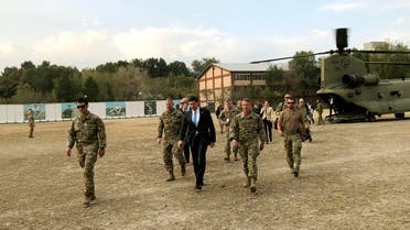 U.S. Defense Secretary Mark Esper, center, walks Gen. Scott Miller, right, chief of the U.S.-led coalition in Afghanistan, at the U.S. military headquarters in Kabul, Afghanistan, Sunday, Oct. 20, 2019.  (AP)