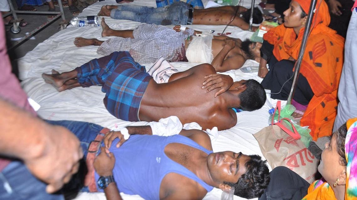 Demonstrators receive medical treatment in a hospital after police fired on people protesting over a Facebook post by a Hindu who allegedly defamed the Prophet Mohammed, in Barisal on October 20, 2019. (AFP)