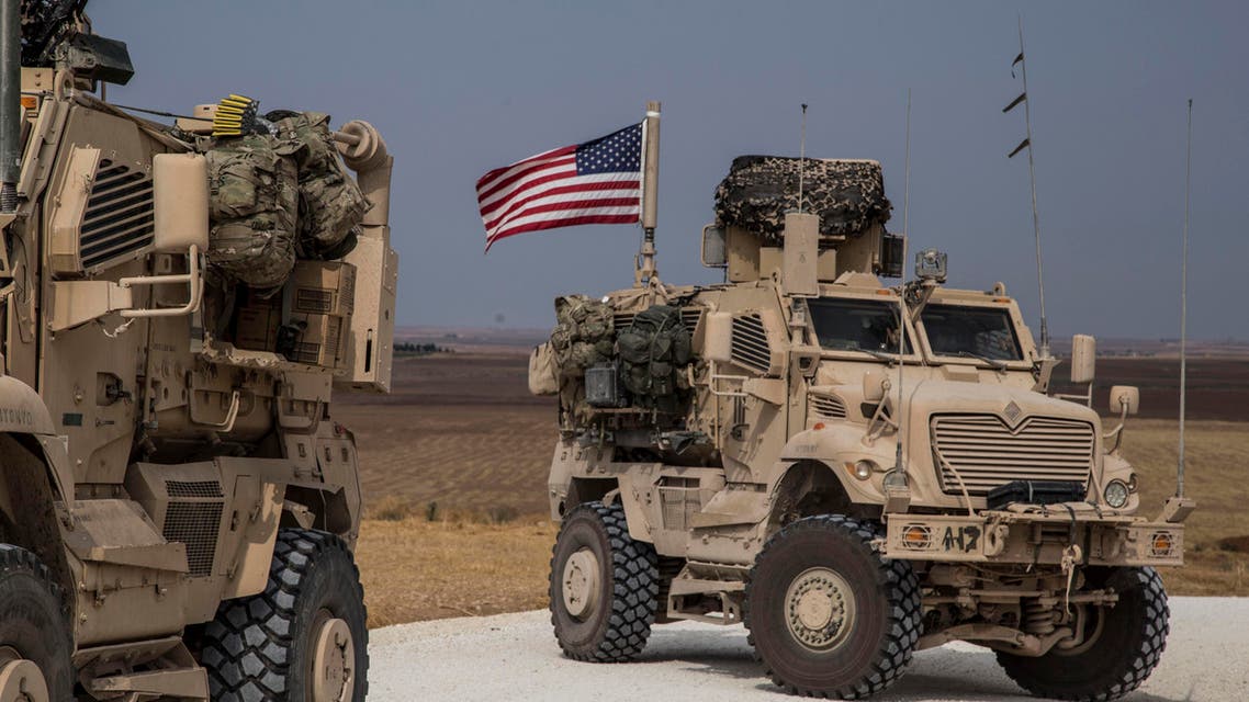American military convoy stops near the town of Tel Tamr, north Syria, Sunday, Oct. 20, 2019. (AP)