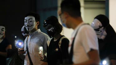 Protesters wear masks during a protest in Hong Kong, Friday, Oct. 18, 2019 (AP)