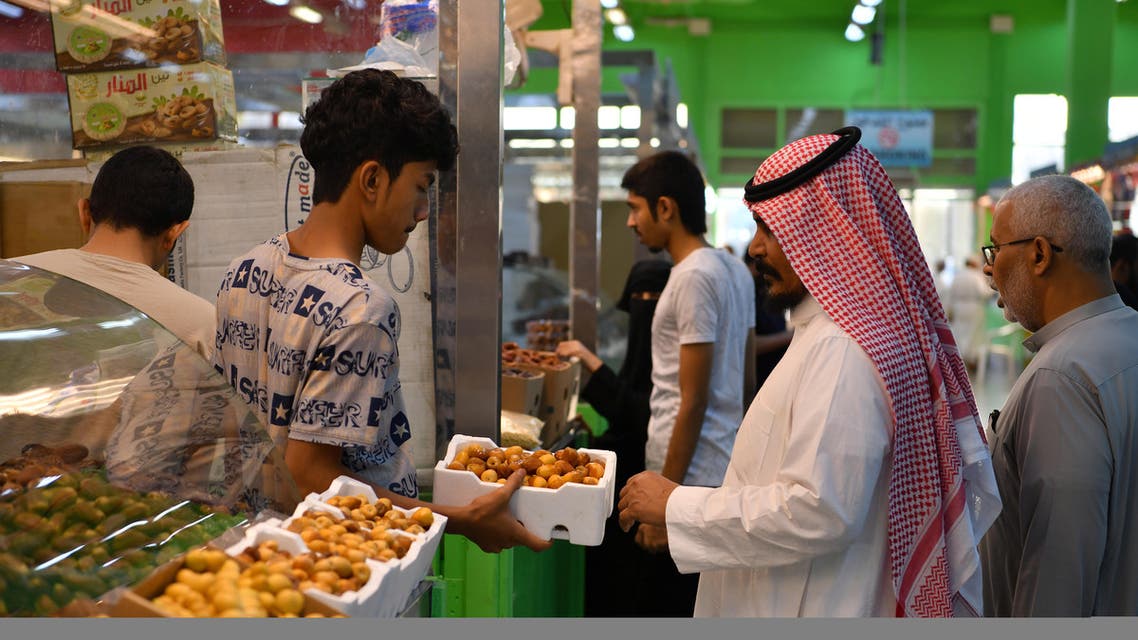 A man sells dates in a food and dates market in Mecca, Saudi Arabia, August 7, 2019. Picture taken August 7, 2019. REUTERS/Waleed Ali
