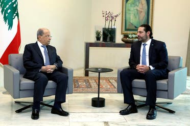 In this photo released by Lebanon's official government photographer Dalati Nohra, Lebanese President Michel Aoun, left, meets with Prime Minister Saad Hariri, ahead of a cabinet meeting, at the presidential palace, in Baabda, east of Beirut, Lebanon, Monday, Oct. 21, 2019. (AP)