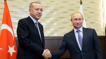 Putin, right, and Turkish President Recep Tayyip Erdogan pose for a photo during their meeting in the Bocharov Ruchei residence in the Black Sea resort of Sochi, Russia, Tuesday, Oct. 22, 2019. (AP)