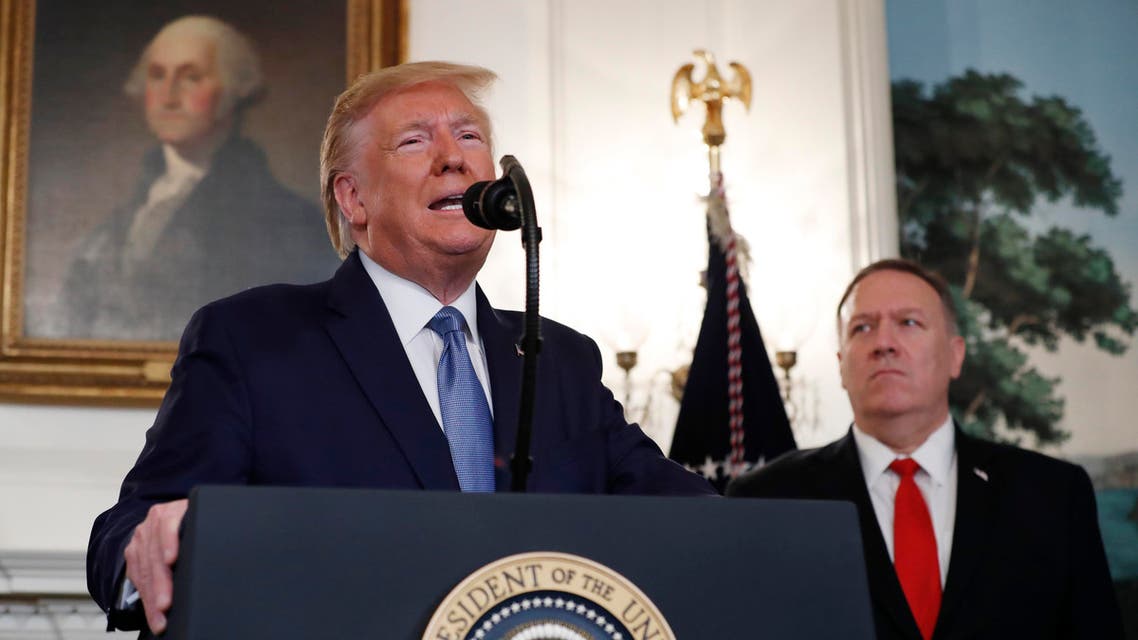 President Donald Trump, accompanied by Secretary of State Mike Pompeo, speaks Wednesday, Oct. 23, 2019, in the Diplomatic Room of the White House in Washington. (AP Photo/Jacquelyn Martin) 