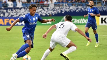 Hilal's midfielder Andre Carrillo fights for the ball with Sadd's midfielder Tarek Salman during the second leg of the AFC Champions League semi-finals football match. (AFP)