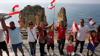 Lebanese protesters successfully form human chain across country