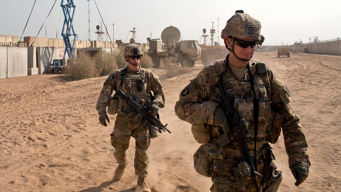 U.S. Army soldiers move through Qayara West Coalition base in Qayara, some 50 kilometers south of Mosul, Iraq. (AP)