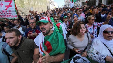 Demonstrators carry national flags and banners during a protest against the country's ruling elite and to demand an end to corruption and the army's withdrawal from politics in Algiers, Algeria October 29, 2019. Picture taken October 29, 2019. REUTERS