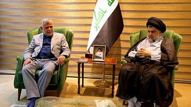 Shiite cleric Muqtada al-Sadr, right, meets with Hadi al-Amiri, commander of the Popular Mobilization Forces, in Baghdad, Iraq, early Monday, May 21, 2018. (AP)