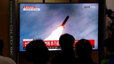 People watch a TV broadcast showing a file footage for a news report on North Korea firing two projectiles, possibly missiles, into the sea, in Seoul. (Reuters)