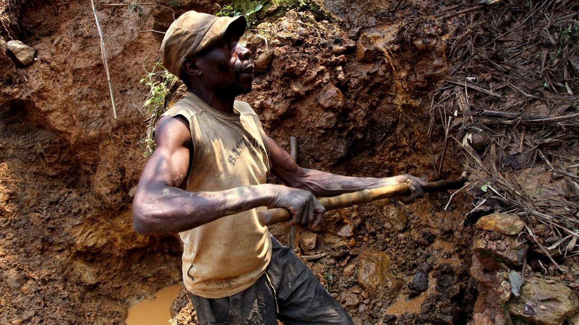 a Congolese miner digs for cassiterite, the major ore of tin, at Nyabibwe mine, in eastern Democratic Republic of Congo. (AP)