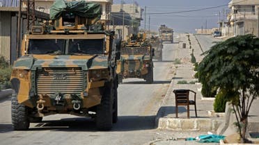 A convoy of Turkish military vehicles passes through the northern Syrian Kurdish town of Tal Abyad on the border between Syria and Turkey on October 31, 2019. (AFP)