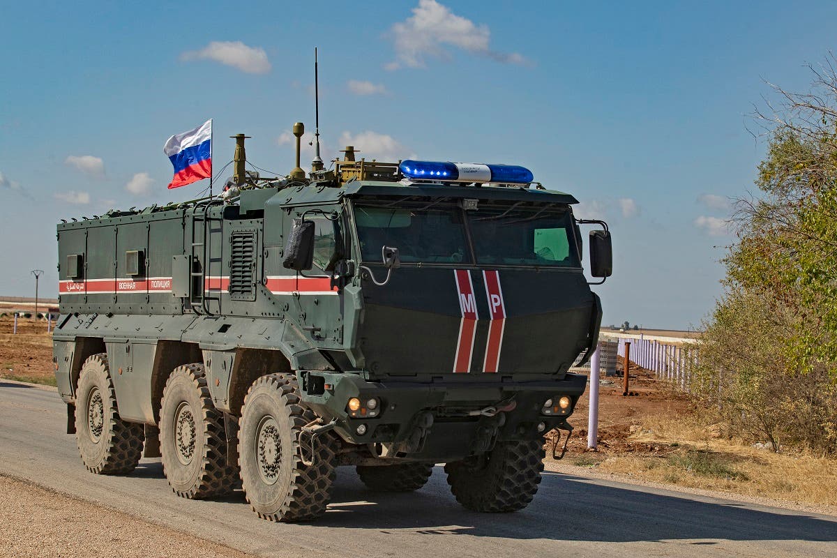 A Russian army vehicle joins a patrol of members of Syrian-Kurdish Asayish internal security forces and Russian military police in the town of Darbasiyah in northeastern Hasakeh province along the Syrian-Turkish border on Oct. 30, 2019. (AFP)