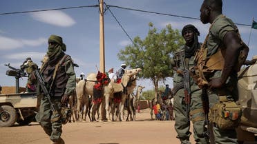 Malian soldiers patrol the roads during the visit of the Malian Prime Minister in Menaka, Mali on May 9, 2018. (AFP)