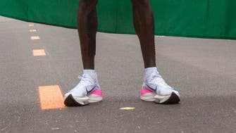 Record-busting shoes loom large in marathon debate