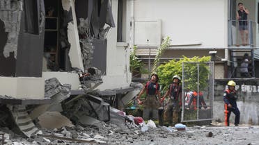 Rescuers look at the damaged condominium building after a 6.5-magnitude earthquake hit Davao City in the southern island of Mindanao on October 31, 2019. (AFP)