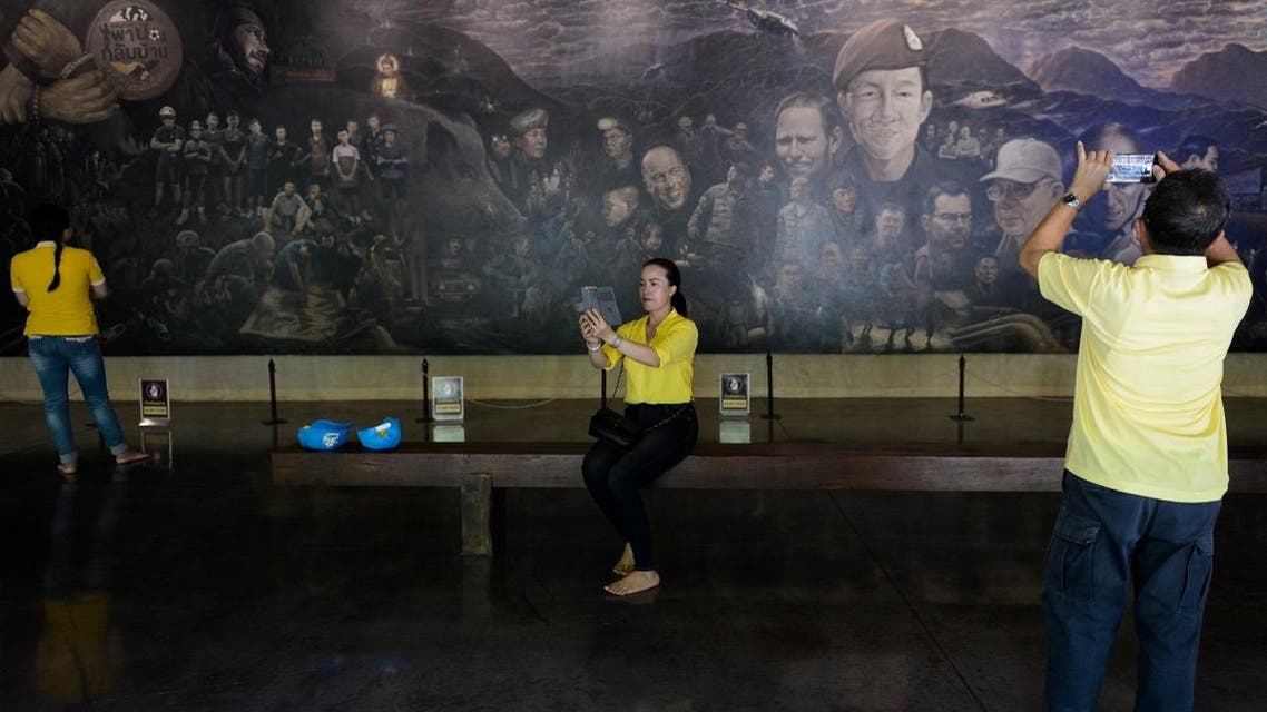 Visitors take pictures at the Tham Luang cave center, which documents the rescue of the "Wild Boars" football team from the cave a year ago, in the Mae Sai district of Chiang Rai province in Thailand. (File photo: AFP)