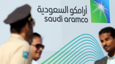 The logo of Aramco is seen as security personnel stand before the start of a press conference by Aramco at the Plaza Conference Center in Dhahran, Saudi Arabia November 3, 2019. REUTERS/Hamad I Mohammed