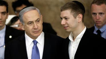 Israeli Prime Minister Benjamin Netanyahu (L) and his son Yair in Jerusalem, on March 18, 2015. (File photo: AFP)
