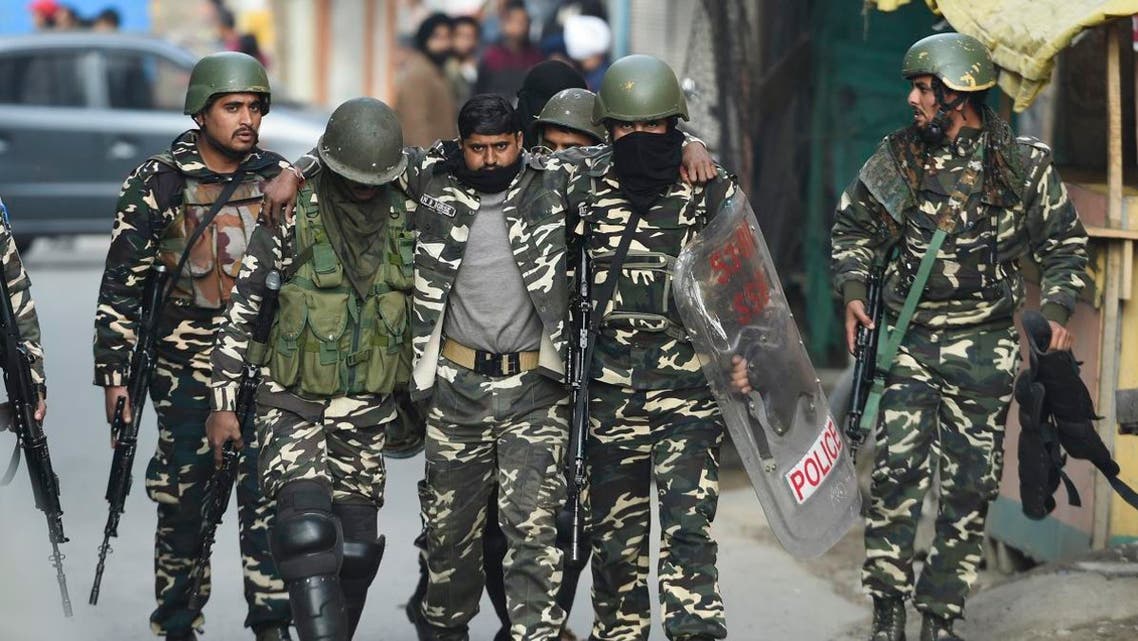 Soldiers evacuate an injured comrade after a grenade blast at a market in Srinagar on November 4, 2019. (AFP)