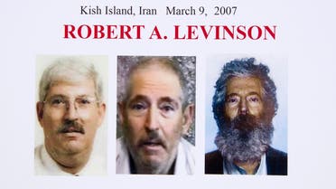 In this March 6, 2012 file photo, an FBI poster showing a composite image of former FBI agent Robert Levinson, right, of how he would look like now after five years in captivity, and an image, center, taken from the video, released by his kidnappers, and a picture before he was kidnapped, left, displayed during a news conference in Washington. (File photo: AP)