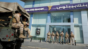 Lebanese army soldiers stand guard outside a branch of Byblos Bank in the southern city of Sidon, Lebanon November 4, 2019. REUTERS
